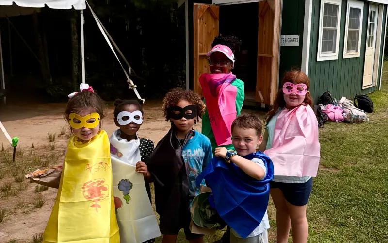 Campers in homemade capes and masks