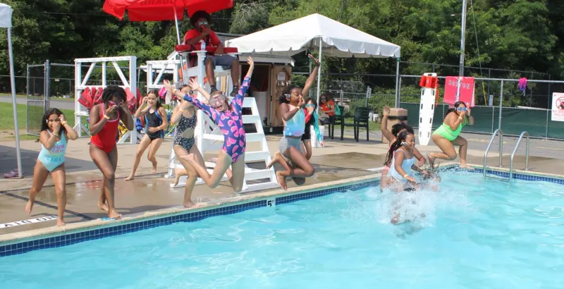 Campers splashing in the camp pool