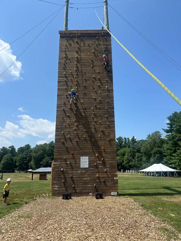 Climbing tower rising above the camp grounds